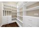 Walk-in closet with custom shelving and drawers, providing ample storage space at 6700 Regency Stone Way, Las Vegas, NV 89148