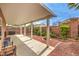 Spacious covered patio and garden, perfect for outdoor entertaining and relaxation at 6843 Philharmonic Ave, Las Vegas, NV 89139