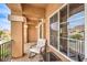 This charming balcony features seating, a small table, and an outside view, creating a relaxing spot at 6843 Philharmonic Ave, Las Vegas, NV 89139