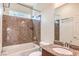 Bathroom with granite countertop, a bathtub, and a large frameless mirror at 6843 Philharmonic Ave, Las Vegas, NV 89139
