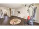 Large bonus room with dark wood floors, sliding glass door, and doorway to the rest of the house at 6843 Philharmonic Ave, Las Vegas, NV 89139
