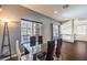 Bright dining area with a glass table, modern chairs, and ample natural light at 6843 Philharmonic Ave, Las Vegas, NV 89139