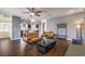 Open-concept living room with hardwood floors and recessed lighting for a bright and modern look at 6843 Philharmonic Ave, Las Vegas, NV 89139