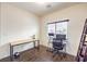 Office space features a computer setup, a desk, and a window at 6843 Philharmonic Ave, Las Vegas, NV 89139