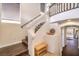 Inviting staircase featuring wood stairs, glass railing, and bright natural light with display niche at 6843 Philharmonic Ave, Las Vegas, NV 89139