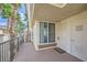 Balcony view with palm trees, leading to the front door and storage at 7151 S Durango Dr # 312, Las Vegas, NV 89113