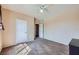 Roomy bedroom with carpet flooring, a ceiling fan, and a neutral color palette at 7151 S Durango Dr # 312, Las Vegas, NV 89113