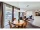 Dining area features a wood table and view into the living room at 7151 S Durango Dr # 312, Las Vegas, NV 89113