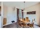 Cozy dining area with wood table and chairs, adjacent to kitchen at 7151 S Durango Dr # 312, Las Vegas, NV 89113