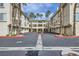 View of the complex, showing garages, apartments, landscaping, and palm trees at 7151 S Durango Dr # 312, Las Vegas, NV 89113