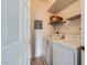Functional laundry area featuring a washer and dryer with storage shelf at 7151 S Durango Dr # 312, Las Vegas, NV 89113
