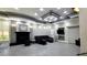 Spacious recreation room with comfortable seating, fireplace, and large-screen TV, perfect for gatherings and relaxation at 7151 S Durango Dr # 312, Las Vegas, NV 89113
