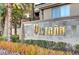 Elegant community entrance sign, showcasing the neighborhood's name amidst colorful foliage and manicured landscaping at 7151 S Durango Dr # 312, Las Vegas, NV 89113