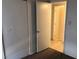 This bedroom features neutral walls, carpet flooring, and a closet with a door ajar at 725 Miller Ave, North Las Vegas, NV 89030