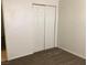 This bedroom features a closet with bifold doors and neutral decor at 725 Miller Ave, North Las Vegas, NV 89030