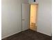 This bedroom offers carpet floors, and a door for natural light at 725 Miller Ave, North Las Vegas, NV 89030