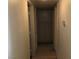 Hallway featuring neutral walls, wooden doors, and tile flooring at 725 Miller Ave, North Las Vegas, NV 89030