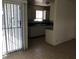 Bright kitchen with modern gray cabinets and convenient access to the living area at 725 Miller Ave, North Las Vegas, NV 89030