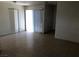 Open living room featuring tile flooring and a sliding glass door for natural light at 725 Miller Ave, North Las Vegas, NV 89030