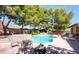 Backyard with pool, spa, and seating at 7664 Angel Crest Cir, Las Vegas, NV 89117