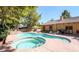 Relaxing backyard features a pool and spa at 7664 Angel Crest Cir, Las Vegas, NV 89117