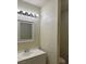 Bathroom featuring a white vanity, large mirror and modern lighting at 7664 Angel Crest Cir, Las Vegas, NV 89117