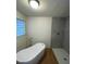 Modern bathroom featuring a freestanding tub and a tiled shower with glass enclosure at 7664 Angel Crest Cir, Las Vegas, NV 89117