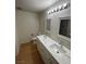 Spacious bathroom featuring double sinks and ample lighting at 7664 Angel Crest Cir, Las Vegas, NV 89117