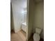 Cozy half bath with white vanity and toilet at 7664 Angel Crest Cir, Las Vegas, NV 89117