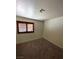 Bedroom with carpeted floors, window with shutters, and neutral walls at 7664 Angel Crest Cir, Las Vegas, NV 89117