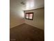 Bedroom featuring neutral walls, carpeted floors and shuttered window at 7664 Angel Crest Cir, Las Vegas, NV 89117