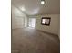 Inviting bedroom with vaulted ceiling, offering ample space and natural light from large windows at 7664 Angel Crest Cir, Las Vegas, NV 89117