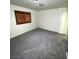 Bedroom featuring neutral carpet, baseboards, and window at 7664 Angel Crest Cir, Las Vegas, NV 89117