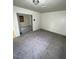 Bedroom with large closet, carpet flooring, and a view of another room at 7664 Angel Crest Cir, Las Vegas, NV 89117