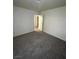 Bedroom featuring neutral carpet, baseboards and white walls at 7664 Angel Crest Cir, Las Vegas, NV 89117