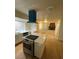 Beautiful updated kitchen boasts stainless appliances, island, and fireplace view at 7664 Angel Crest Cir, Las Vegas, NV 89117