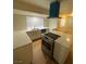 Renovated kitchen with stainless appliances, bright countertops, and spacious layout at 7664 Angel Crest Cir, Las Vegas, NV 89117
