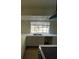 Modern kitchen features bright countertops, stainless sink and a large window at 7664 Angel Crest Cir, Las Vegas, NV 89117