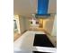 Updated kitchen features stainless cooktop on island, ample counterspace and adjacent living area at 7664 Angel Crest Cir, Las Vegas, NV 89117