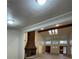 Open living area featuring brick fireplace, high ceilings, wood beams, and lots of light at 7664 Angel Crest Cir, Las Vegas, NV 89117