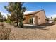Cozy backyard patio with rock landscaping, perfect for outdoor relaxing at 7824 Pine Warbler Way, North Las Vegas, NV 89084