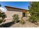 Backyard featuring low-maintenance desert landscaping, a covered patio, and privacy at 7824 Pine Warbler Way, North Las Vegas, NV 89084