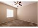 Neutral bedroom with carpet and ceiling fan showcasing a comfortable, inviting space at 7824 Pine Warbler Way, North Las Vegas, NV 89084
