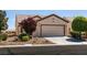 Charming single-story home with desert landscaping, a two-car garage and a well-maintained front yard at 7824 Pine Warbler Way, North Las Vegas, NV 89084