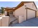 Well-maintained single-Gathering home with a two-car garage, desert landscaping, and a private gated front porch at 7824 Pine Warbler Way, North Las Vegas, NV 89084