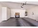 Spacious garage with water heater, storage, and workbench offers ample space for vehicles and projects at 7824 Pine Warbler Way, North Las Vegas, NV 89084
