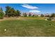 Scenic view of the lush golf course with mountain backdrop under blue sky at 7824 Pine Warbler Way, North Las Vegas, NV 89084