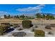 Picturesque golf course view with desert landscaping and mountain views at 7824 Pine Warbler Way, North Las Vegas, NV 89084