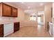 Open-concept kitchen features tile flooring and wood cabinets at 7824 Pine Warbler Way, North Las Vegas, NV 89084