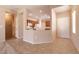 Open-concept living space with tile flooring, neutral paint, and ample natural light, perfect for entertaining at 7824 Pine Warbler Way, North Las Vegas, NV 89084